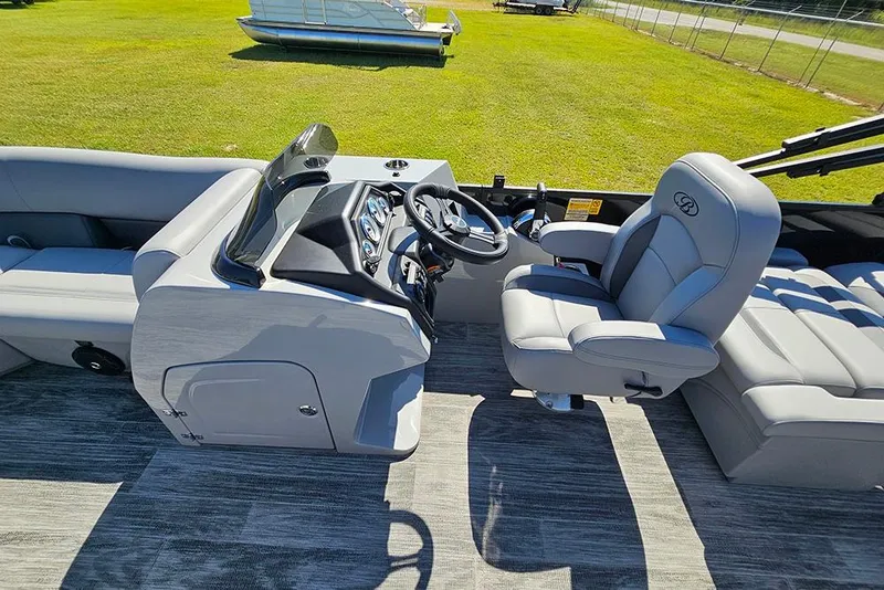 Slide: The Image of 2026 Bentley Pontoons Legacy 223 Quad Swing Back 3/4 Tritoon interior with helm and seating. - 19