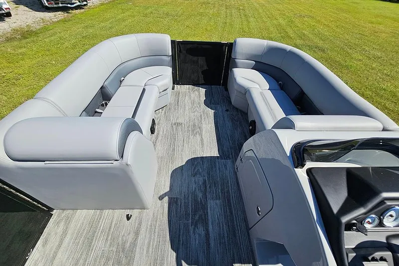 Slide: The Image of 2026 Bentley Pontoons Legacy 223 interior with gray seating and spacious layout. - 24