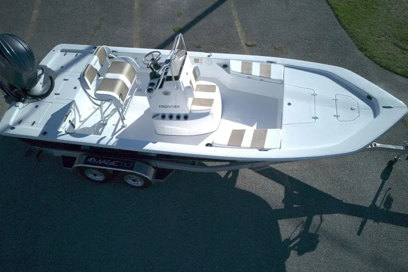 Slide: The Image of Aerial view of 2026 Frontier 2104 boat on trailer, featuring dual seats and spacious deck. - 3