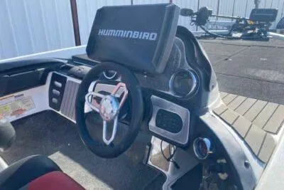 Slide: The Image of 2012 Skeeter FX20 boat dashboard with Humminbird electronics and steering wheel. - 5