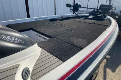 Slide: The Image of 2012 Skeeter FX20 bass boat with Power-Pole, black deck, and trolling motor. - 7