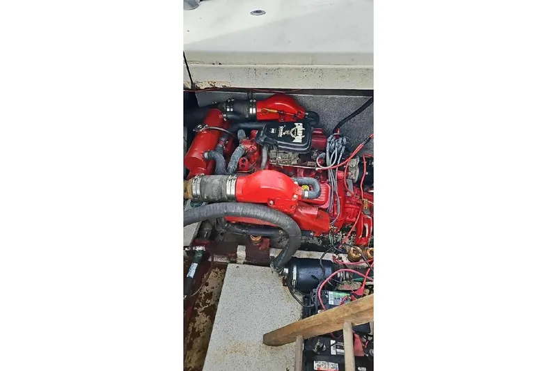 Slide: The Image of Engine compartment of a 1996 Gibson 41 Classic Houseboat with red components and wiring. - 10