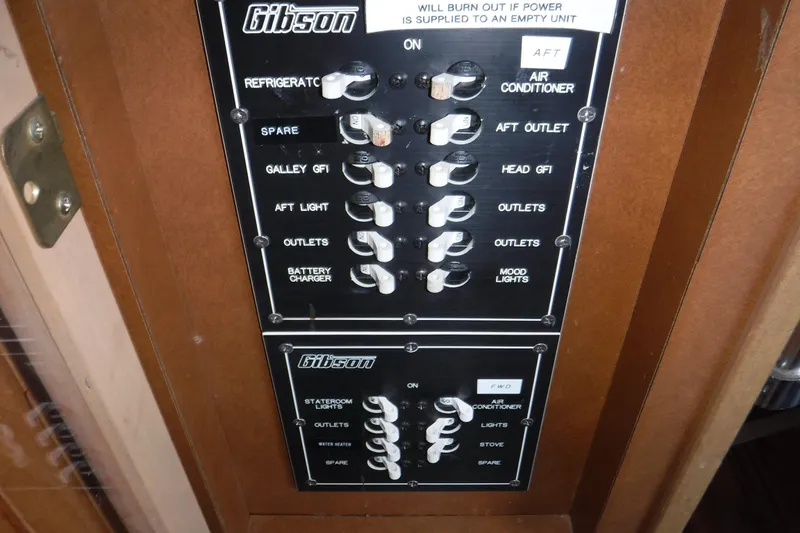Slide: The Image of Control panel of a 1994 Gibson 41 Classic Houseboat with labeled switches. - 37