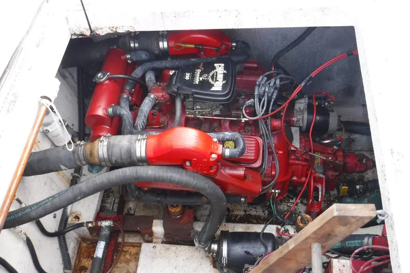 Slide: The Image of Engine compartment of a 1994 Gibson 41 Classic Houseboat with red components. - 53