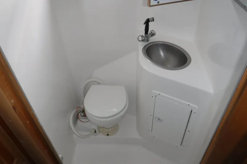 Slide: The Image of Compact bathroom in 1994 Gibson 41 Classic Houseboat with toilet and sink. - 58