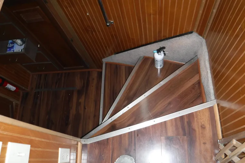 Slide: The Image of Interior of 1994 Gibson 41 Classic Houseboat with wooden stairs and paneling. - 59