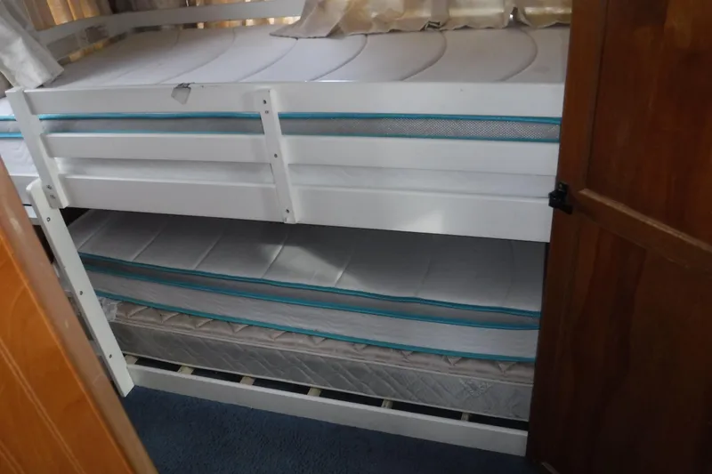 Slide: The Image of Bunk beds inside a 1994 Gibson 41 Classic Houseboat cabin. - 63
