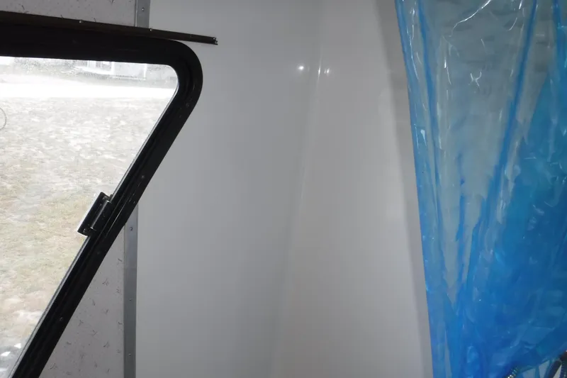 Slide: The Image of Interior view of 1994 Gibson 41 Classic Houseboat with window and blue curtain. - 64