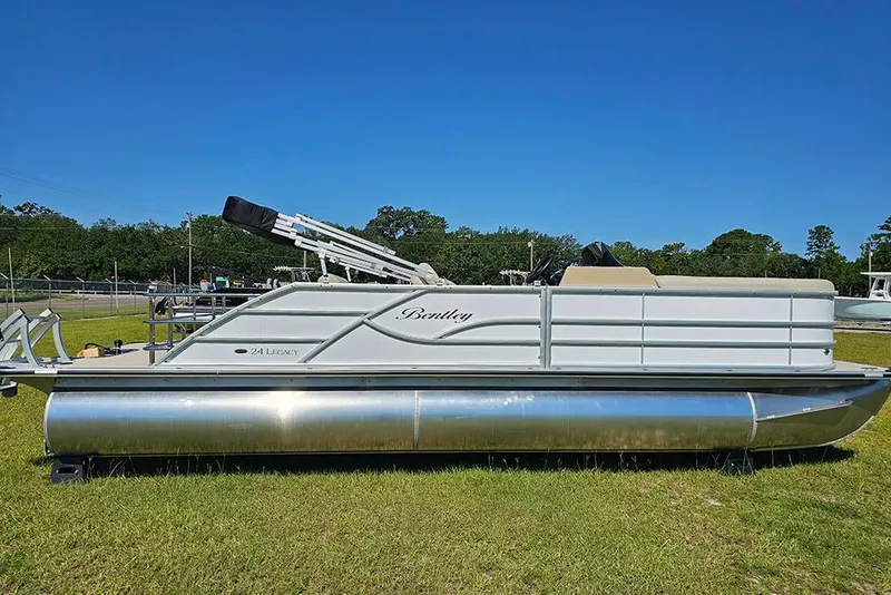 Slide: The Image of 2026 Bentley Pontoons 243 Legacy Swingback (Sport3) on display outdoors. - 1