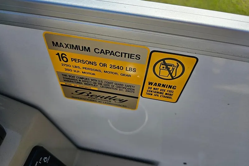 Slide: The Image of 2026 Bentley Pontoons 243 Legacy Swingback Sport3 with luxurious seating and cup holders. - 17