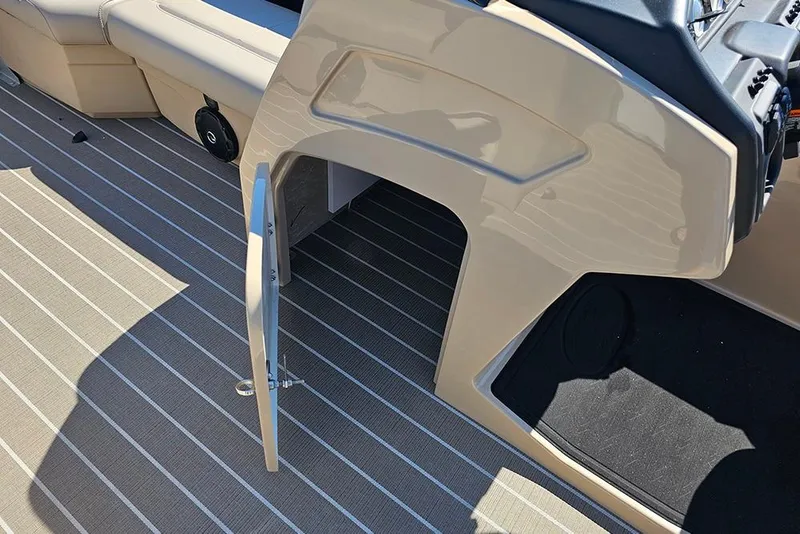 Slide: The Image of 2026 Bentley Pontoons 243 Legacy Swingback dashboard with steering wheel and gauges. - 21