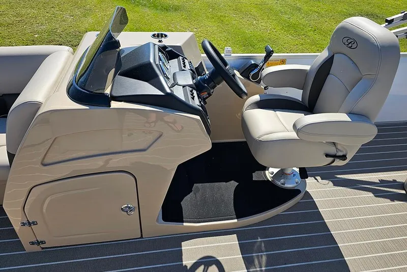 Slide: The Image of 2026 Bentley Pontoons 243 Legacy Swingback interior console and seating detail. - 22