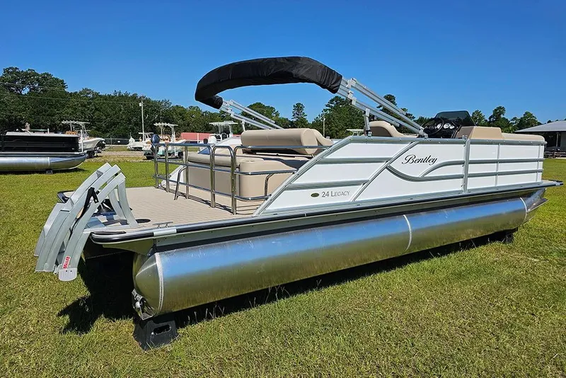 Slide: The Image of 2026 Bentley Pontoons 243 Legacy Swingback Sport3 on grass under clear blue sky. - 3
