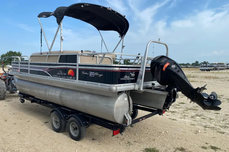 Slide: The Image of 2015 Sun Tracker Fishin' Barge 20 DLX pontoon boat with canopy and outboard motor. - 3