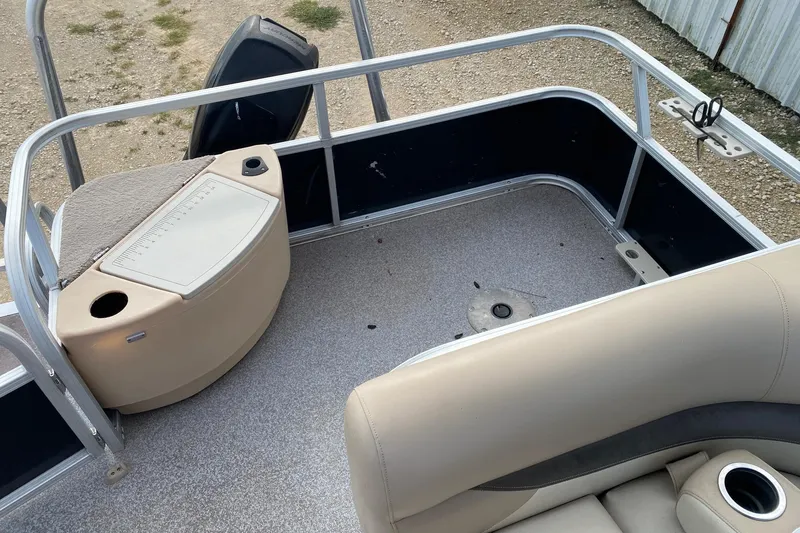 Slide: The Image of 2015 Sun Tracker Fishin' Barge 20 DLX interior with seating and storage area. - 7