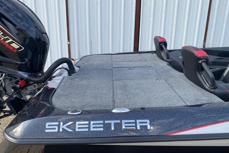 Slide: The Image of 2026 Skeeter ZXE21 boat with sleek design and powerful engine, featuring comfortable seating. - 10