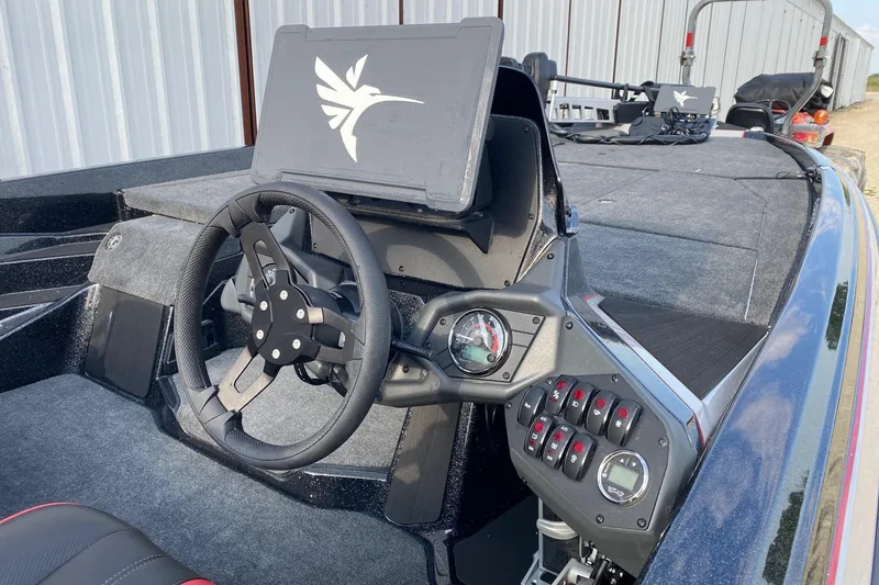 Slide: The Image of 2026 Skeeter ZXE21 boat interior with steering wheel and control panel. - 6