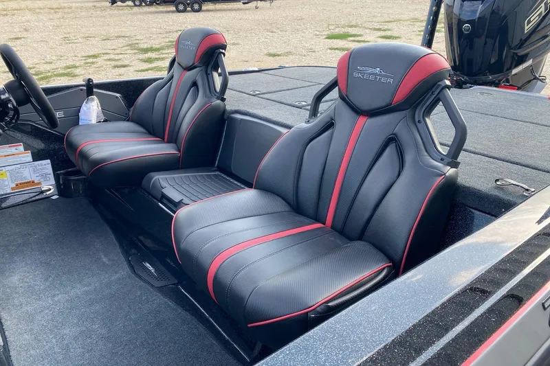 Slide: The Image of 2026 Skeeter ZXE21 boat interior with black and red seats, sleek design. - 8