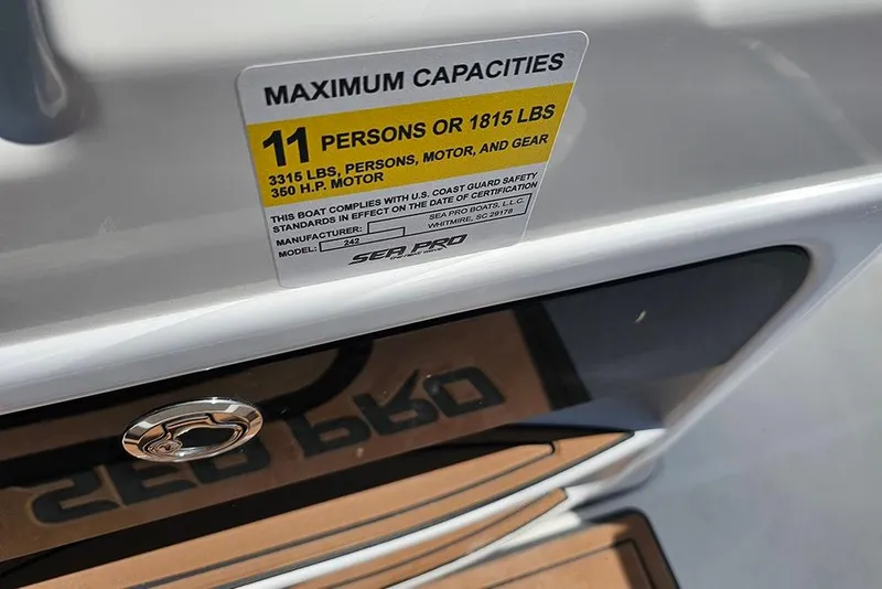 Slide: The Image of 2025 Sea Pro 242 Center Console capacity label, 11 persons or 1815 lbs, 350 HP motor. - 22