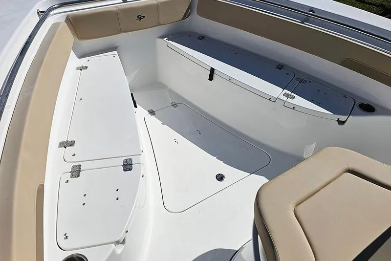 Slide: The Image of 2025 Sea Pro 242 Center Console boat interior with seating and storage compartments. - 27