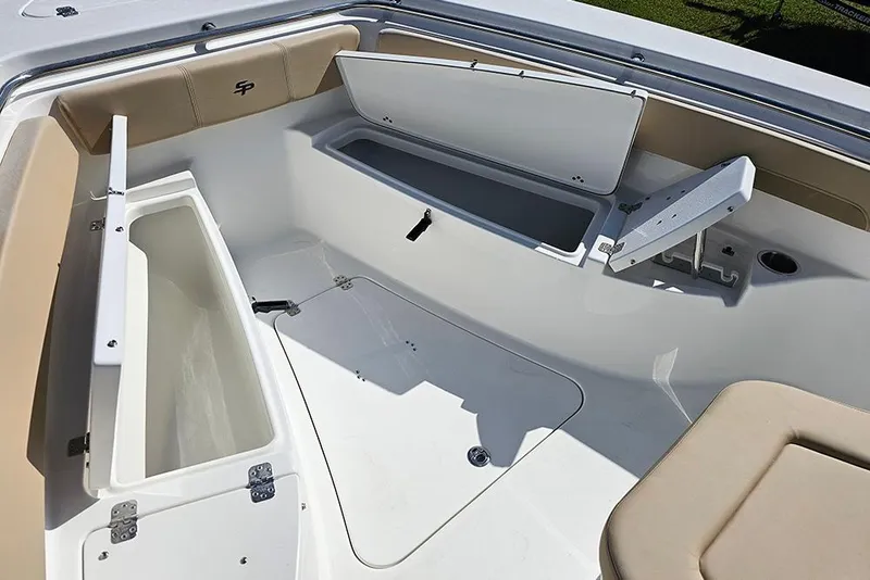Slide: The Image of 2025 Sea Pro 242 Center Console boat interior with open storage compartments. - 28