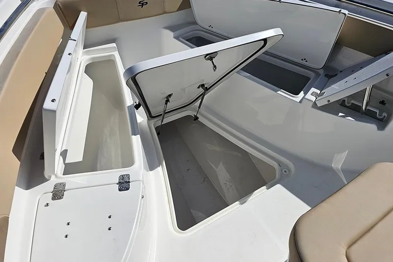 Slide: The Image of 2025 Sea Pro 242 Center Console boat with open storage compartments. - 29