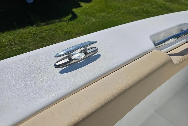 Slide: The Image of 2025 Sea Pro 242 Center Console boat cleat on white and beige deck. - 31