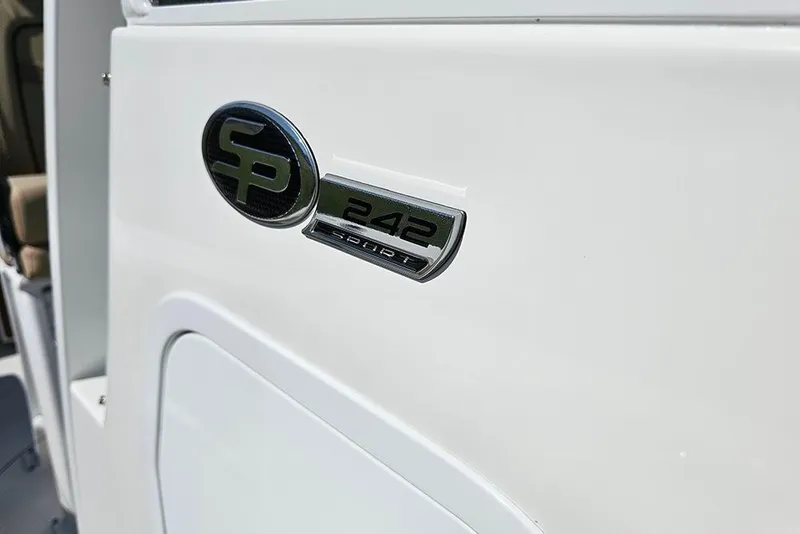 Slide: The Image of 2025 Sea Pro 242 Center Console boat emblem on white surface. - 32