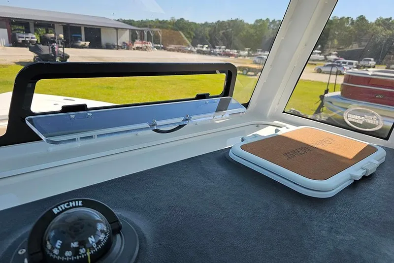 Slide: The Image of Interior view of 2025 Sea Pro 242 Center Console boat with compass and hatch. - 35