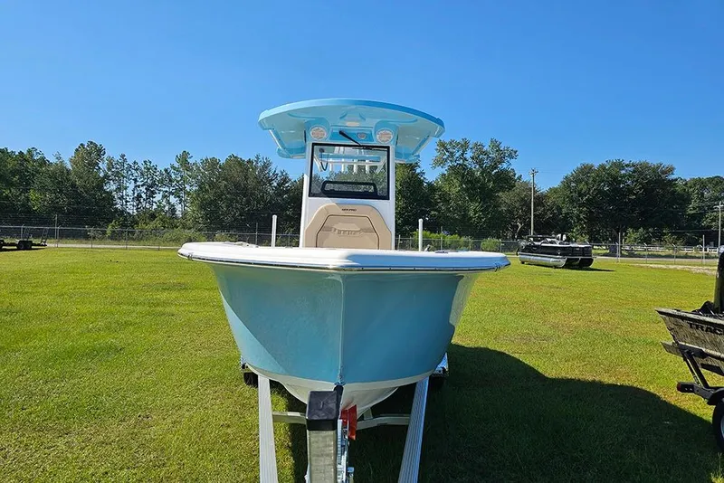 Slide: The Image of 2025 Sea Pro 242 Center Console boat on trailer, displayed on grassy field. - 4