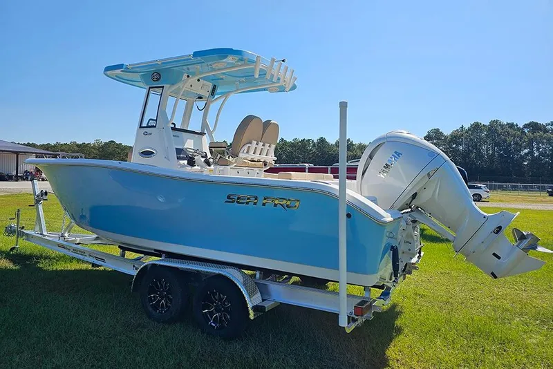 Slide: The Image of 2025 Sea Pro 242 Center Console boat on trailer, blue hull, Yamaha outboard engine. - 7