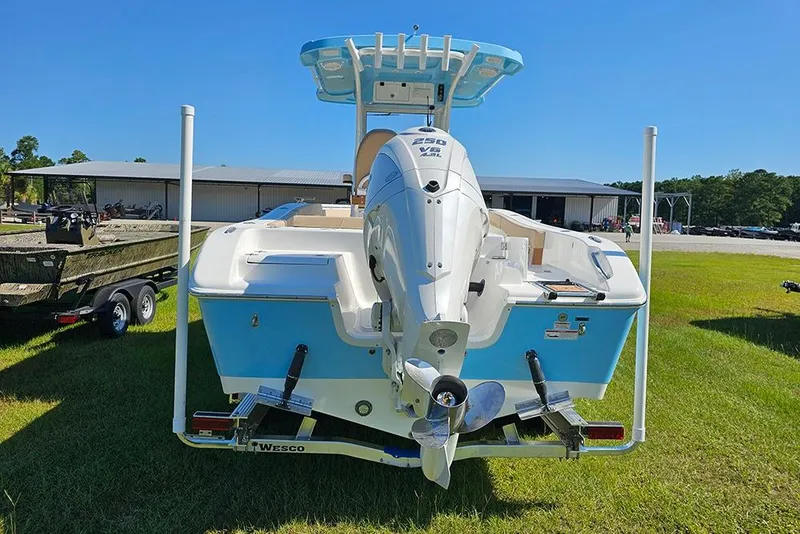 Slide: The Image of 2025 Sea Pro 242 Center Console boat with powerful outboard motor on trailer. - 8