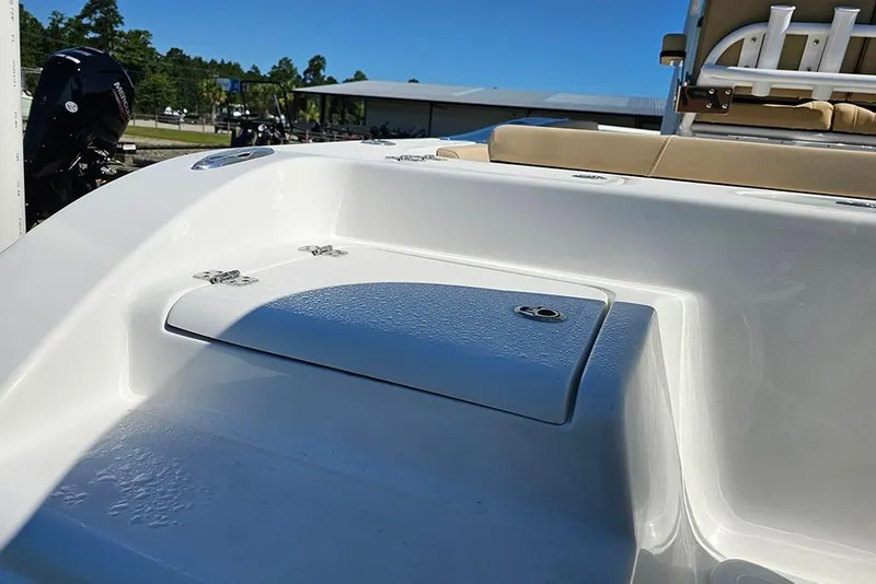 Slide: The Image of 2025 Sea Pro 242 Center Console boat interior with seating and storage compartment. - 9