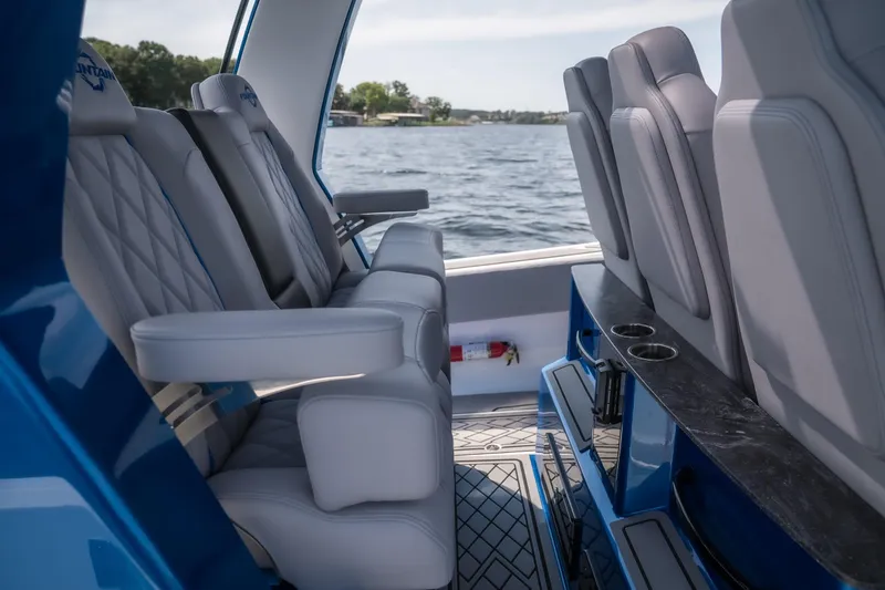 Slide: The Image of Interior of 2026 Fountain 43 SCX boat with luxurious seating and cup holders. - 10