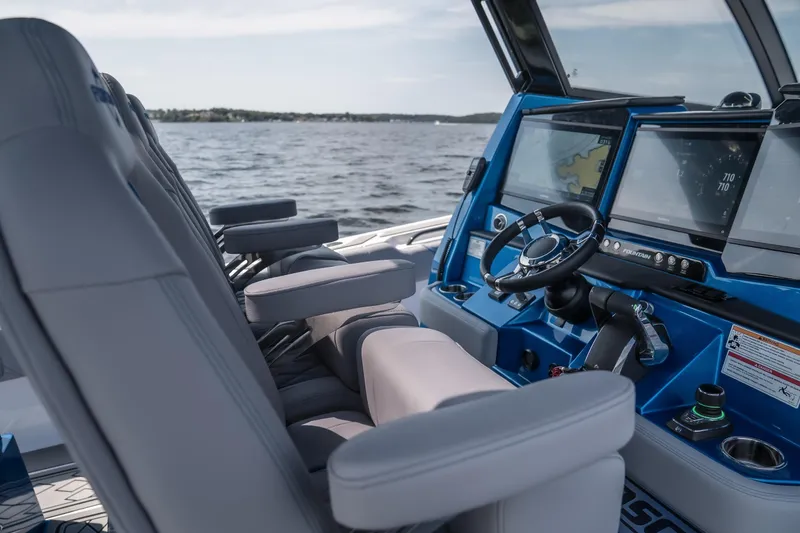 Slide: The Image of Interior of 2026 Fountain 43 SCX boat with modern dashboard and seating. - 11