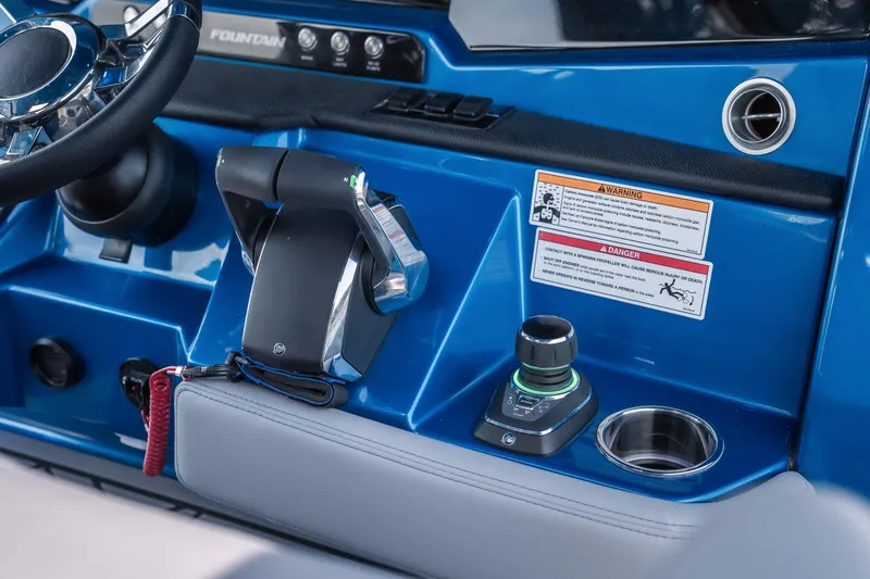 Slide: The Image of 2026 Fountain 43 SCX boat dashboard with steering wheel and control panel. - 12