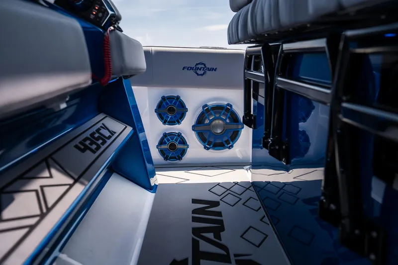 Slide: The Image of 2026 Fountain 43 SCX boat interior with blue speakers and sleek design elements. - 18
