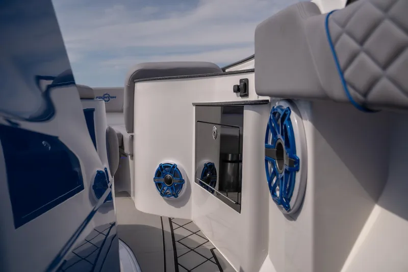 Slide: The Image of 2026 Fountain 43 SCX boat interior with blue speakers and modern design. - 24