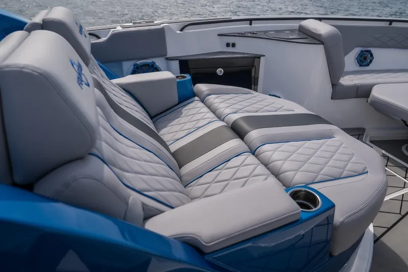 Slide: The Image of Luxurious seating on 2026 Fountain 43 SCX boat with quilted upholstery and cup holders. - 26