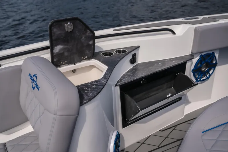 Slide: The Image of 2026 Fountain 43 SCX boat interior with seating, storage, and cup holders. - 27