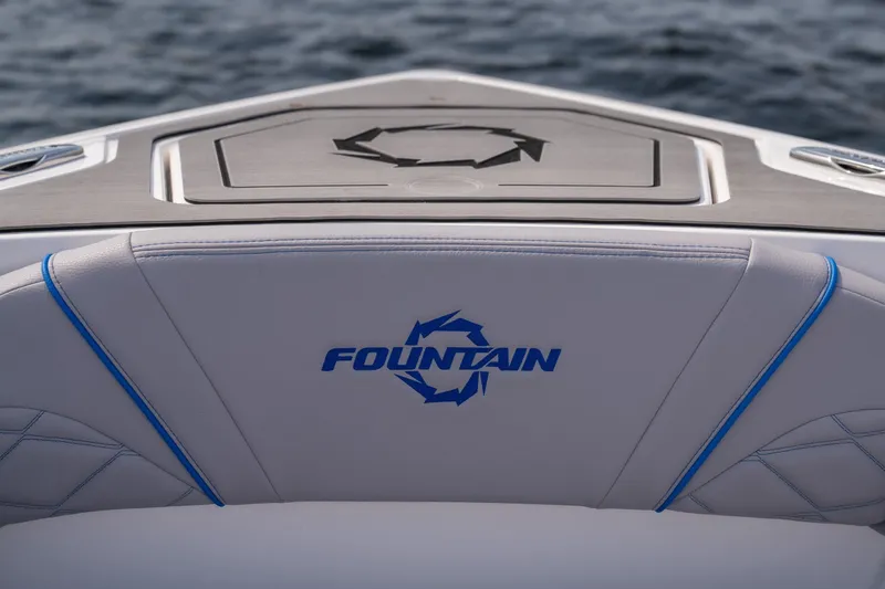 Slide: The Image of 2026 Fountain 43 SCX boat interior with logo, featuring sleek design and ocean backdrop. - 28