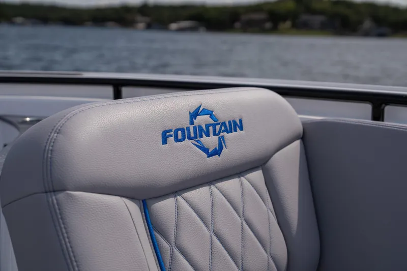 Slide: The Image of Fountain 43 SCX 2026 boat seat with logo, on a lake background. - 29