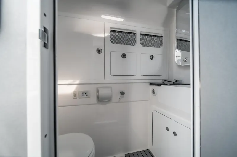 Slide: The Image of Modern bathroom interior of 2026 Fountain 43 SCX boat, featuring sleek cabinetry and fixtures. - 36