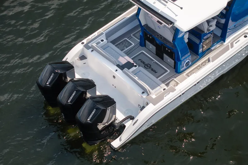 Slide: The Image of 2026 Fountain 43 SCX boat with triple outboard engines on water. - 37