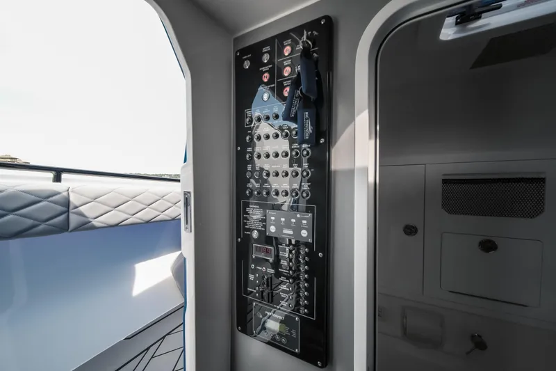 Slide: The Image of Control panel inside 2026 Fountain 43 SCX boat, featuring modern switches and sleek design. - 39