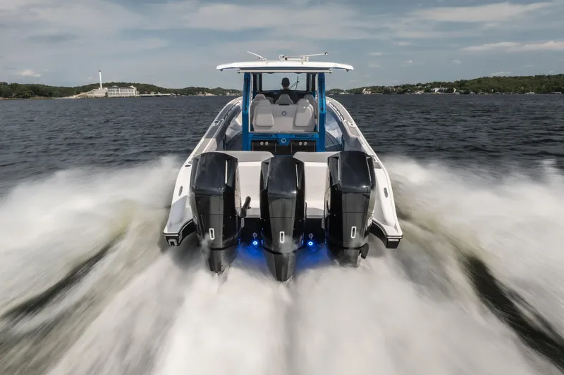 Slide: The Image of 2026 Fountain 43 SCX boat speeding on water with powerful engines. - 4
