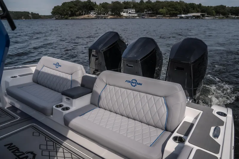 Slide: The Image of 2026 Fountain 43 SCX boat with triple engines and luxurious seating on a lake. - 6