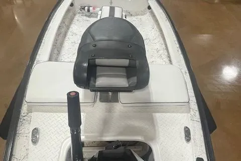 Slide: The Image of 2020 Santee 160TS kayak with padded seat and paddle, displayed indoors. - 6