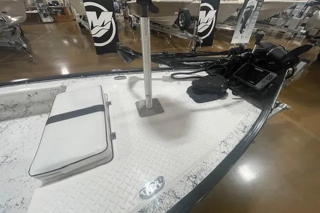 Slide: The Image of 2020 Santee 160TS boat interior with trolling motor and white seat cushion. - 7