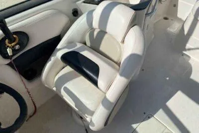 Slide: The Image of 2008 Chaparral Sunesta 224 boat interior with white and black seating. - 8